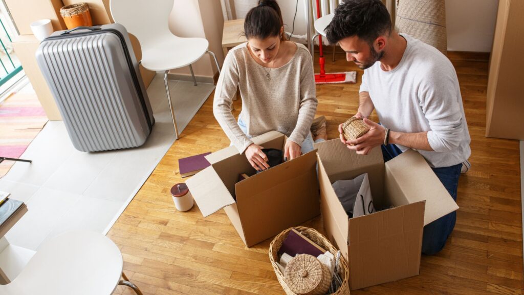 Rajdhani Movers packing fragile items carefully.